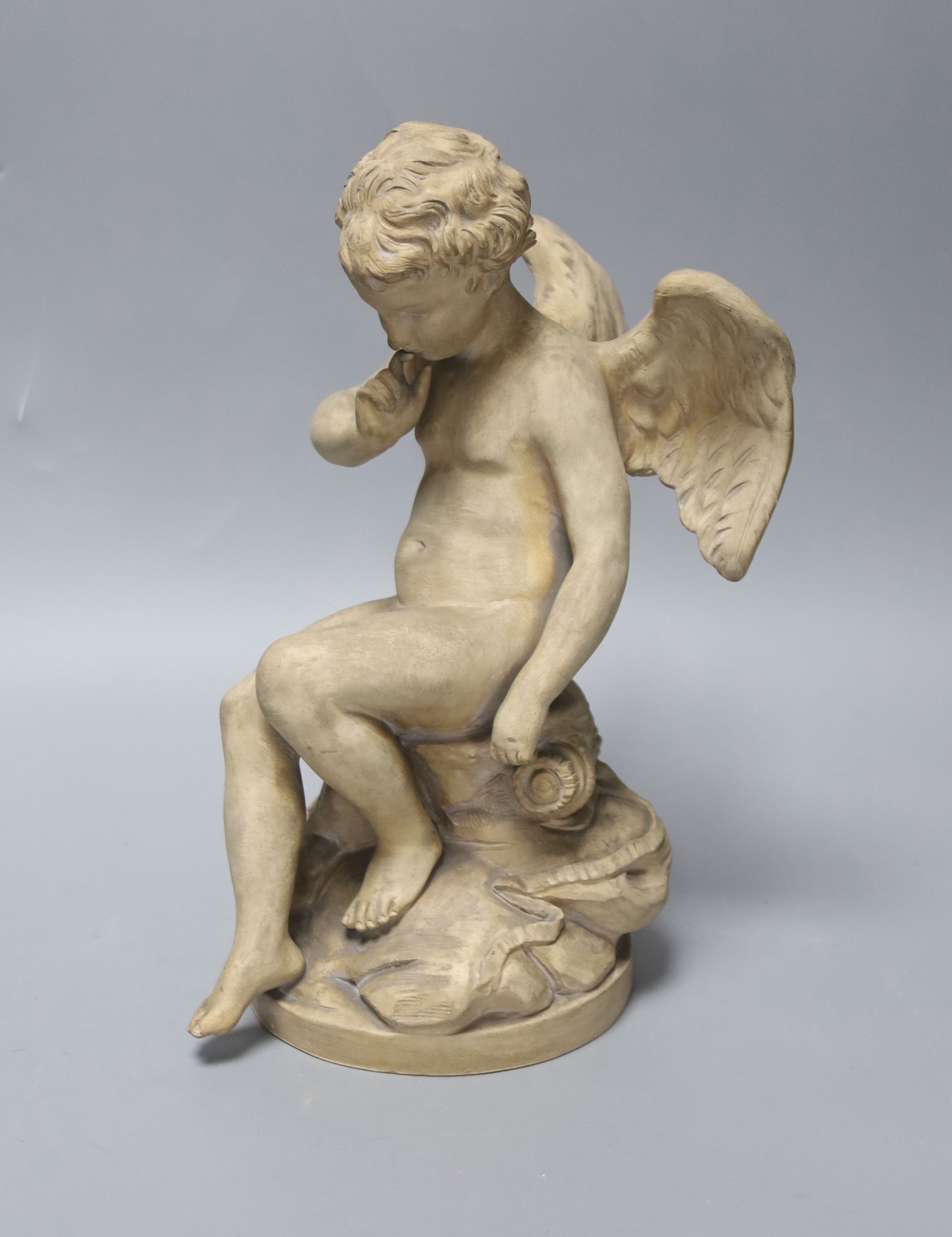 A Sevres style terracotta figure of Cupid, 25cm